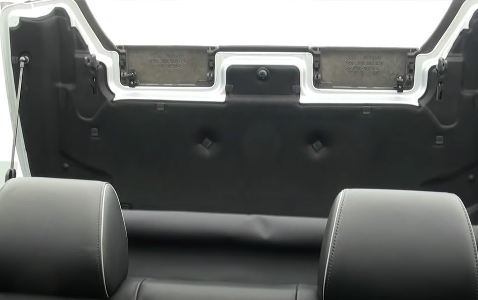 The back seats of a Jeep are empty, showcasing the spacious interior designed for passengers and cargo.