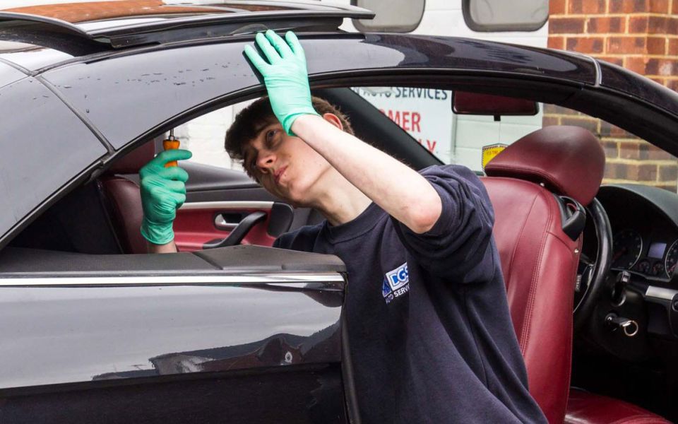 mechanic fixes Eos roof