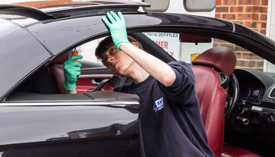 mechanic fixes Eos roof